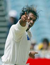 Pakistans Shoaib Akhtar celebrates after dismissing Australias Shane Warne