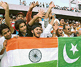 Hockey fans show flags of India and Pakistan painted on one piece of cloth during a match organised at Chandigarh as part of the Dosti hockey series