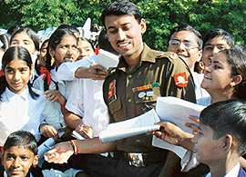 Olympic medal winner Maj R.S. Rathore with students during his visit to Chandimandir Military Station