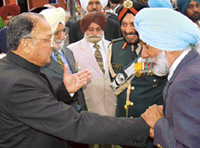 Maj-Gen (retd.) Tarlochan Singh (right) clasps Gen SF Rodrigues hand as old friends meet at the swearing-in ceremony of the latter as Governor of Punjab in Chandigarh