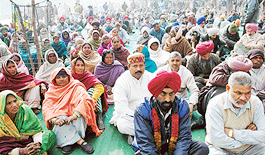 Members of the coordination committee of government and MC employees hold a dharna at Matka Chowk, Chandigarh, on Wednesday.
