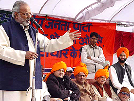 Haryana unit BJP president Ganeshi Lal addresses an election rally at Naggal in Ambala on Wednesday