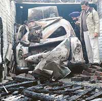 The damaged official car of Dr D.J. Singh, Deputy Director, Punjab Police Academy, which caught fire on Tuesday night in Ludhiana. 