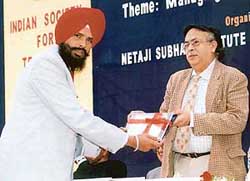 Dr Major Singh Randhawa receives national award from Mr R.S. Sethi, Principal Secretary, Delhi Government, for his paper on Human values, in Delhi. 