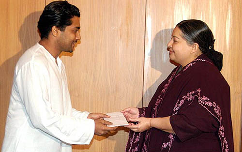 Tamil Nadu Chief Minister J Jayalalithaa receives a cheque for Rs 2 lakh from Tamil cine star Surya, for Chief Minister's relief fund for tsunami victims, in Chennai on Wednesday.  PTI