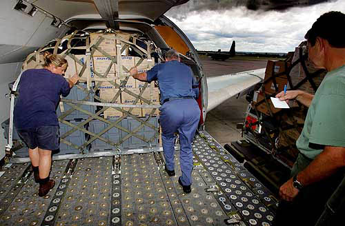 Australian defence force personnel load medical supplies aboard an Australian Air Force plane bound for the tsunami-affected areas in Asia at the Richmond Air Force Base in Sydney on December 29.  Reuters