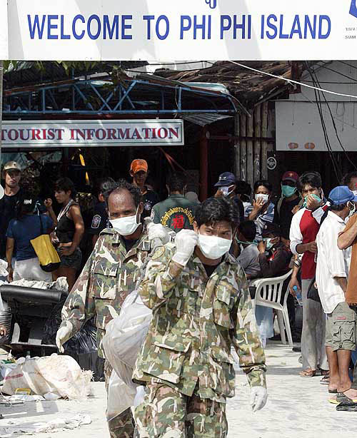 Rescue workers carry a body in Ton Sai Bay in Thailand's Phi Phi island on December 29, after a tsunami hit the area.  Reuters