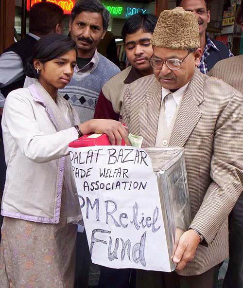A social worker from Adalat Bazar Trade Welfare Association collects donations for the PM's Relief Fund for tsunami-affected people, in Patiala on Wednesday.  Photo by Rajesh Sachar