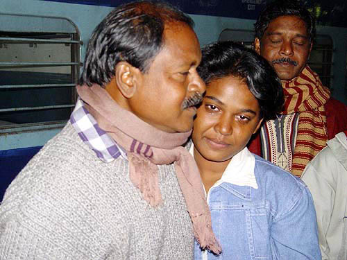 A relieved father is reunited with his daughter on her safe arrival in Tata Nagar on Tuesday from Port Blair where she had gone on a school excursion when the killer tsunami wave swept the island.  PTI