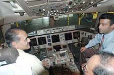 Union Minister of State for Civil Aviation (Independent charge) Praful Patel checks out the cockpit of the new Boeing 777-ER aircraft inducted in the A-I fleet, in Mumbai
