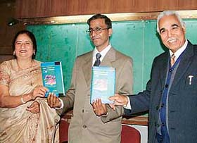 Dalip Kumar, DPI Colleges, releases a book, "Federal Transfers and Inter-State Disparities in India", at ICSSR Auditorium, Panjab University, in Chandigarh