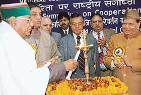 Mr Sat Mahajan, Himachal Minister for Revenue and Panchayati Raj, inaugurates a symposium and debate on cooperation at Regional Institute of Cooperative Management, Sector 32, Chandigarh