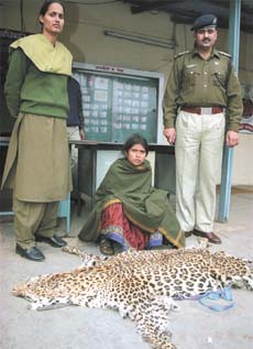 Kamran (sitting), who was arrested by Railway Police Force with a leopard skin at New Delhi railway station