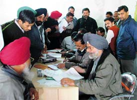 Officials of the Central Excise Department interact with transporters during a service tax registration camp at Transport Nagar in Ludhiana on Thursday