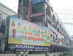 The huge hoarding put up in front of main entrance of Nehru Shopping Complex by the Amritsar Improvement Trust.