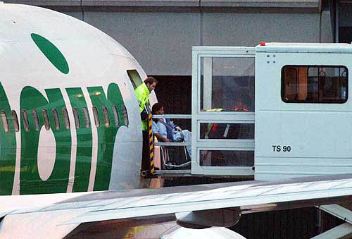 Swiss tourists arrive at the Zurich airport on a flight from Phuket, Thailand, late on December 29. The Swiss government and Swiss travel agencies chartered a plane to repatriate 132 Swiss tourists, 35 of them with injuries, stuck in the Phuket region, where a tsunami devastated beaches and resorts visited by many European tourists.  AP/PTI