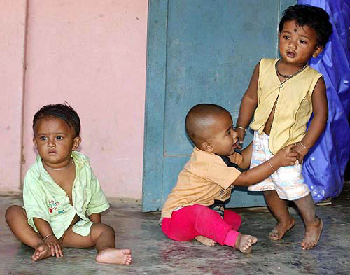 They are from different family, but devastation has brought them close at a relief camp in Port Blair on Thursday.  PTI