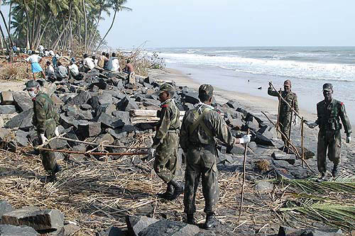 Army jawans carry out relief and rescue operations at the tsunami-hit Devanampattinam village in Cuddalore on Thursday.  PTI