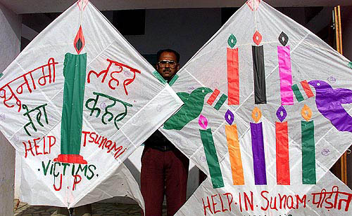 Jagmohan Kanojia, an Indian kite maker, decorates two giant kites with messages for tsunami victims in Amritsar on December 30.  Reuters