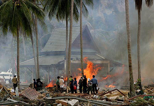 Workers burn garbage in Thailand's Phi Phi island on December 30. Millions of persons on the Indian Ocean shores scrambled for food and clean water on Thursday, with disease and hunger now the main threats stalking survivors of the most devastating tsunami on record.  Reuters
