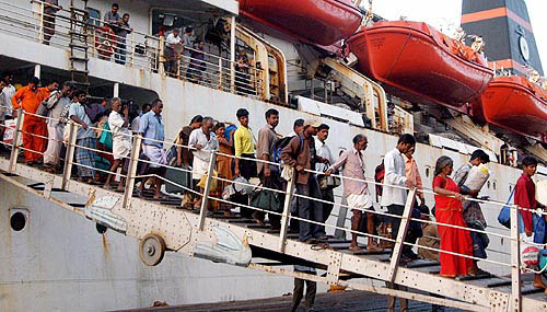Indian tsunami survivors from Andaman island arrive at a port in Chennai on December 30.  Reuters