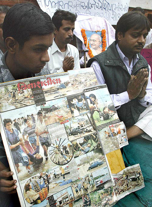 Gujarat earthquake victims pray for tsunami victims, in Ahmedabad on December 30.  Reuters