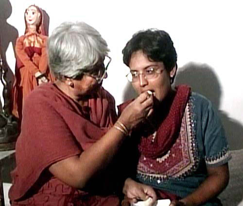 Nivedita Kanitkar from Pune, who swam to safety battling 20-foot-high waves, being offered sweets by her mother on her safe return back home on December 30. The young girl, an employee of the Taj Exotica in the tiny island resort of Maldives and an average swimmer, showed rare courage, cheating Asia's worst tsunami on record that has killed over 1,00,000 across South Asia.  ANI
