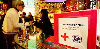 A donation box for tsunami relief is placed inside a pub at Hong Kongs Lan Kwai Fong entertainment district on the eve of the New Years Day