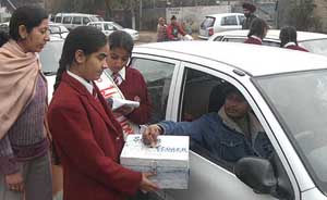 Schoolchildren collect donations for the Prime Minister's National Relief Fund for tsunami victims in Amritsar