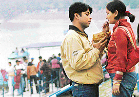 Unmindful of their surroundings, newly-weds sip coconut water at the Sukhna Lake, Chandigarh, on Saturday. 