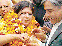 Ms Anu Chatrath on her election as Mayor is offered sweets by local MP Pawan Bansal at the Municipal Corporation office in Chandigarh on Saturday.