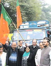 Relief material for tsunami-affected victims being flagged off by BJP MP, V. K. Malhotra, Sushma Swaraj and Dr Harshvardhan in the Capital on Saturday.