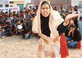 Punjab Engineering College students stage a play on AIDS at Janata Colony in Naya Gaon near Chandigarh on Sunday. 