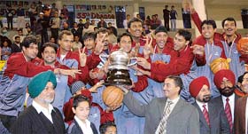 The Uttranchal team which scored its maiden title victory, beating Punjab 75-59, in the 55th Dhanoa Senior National Basketball Championbship in Ludhiana on Sunday.