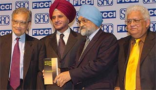 Prof Amartya Sen, Nobel laureate and Lamont University Professor of Economics, Harvard University, Onkar S. Kanwar, president of Ficci, Dr Montek Singh Ahluwalaia Deputy Chairman Planning Commission, and Lord Meghnad Desai, Professor Emeritus, London School of Economics, at a seminar