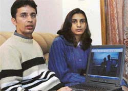 Gaurav Kumar and his wife, Nitika, recall their harrowing experience at Langkawi Islands, which was hit by tsunami as they show images on their laptop in Panchkula on Monday. 