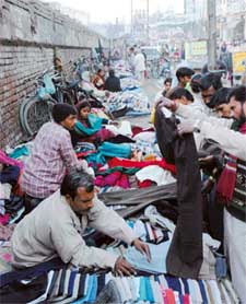 The market under the Jagraon bridge displays a wide range of second-hand clothes