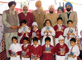 Prize winners of Akal Sahay Senior Secondary School with guests of honour at a prize distribution function held in Ludhiana on Monday