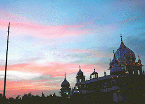The setting sun adds a dash of colour and spectacle to the illumination of Sector-38 (West) gurdwara on the eve of Gurpurb in Chandigarh on Tuesday.