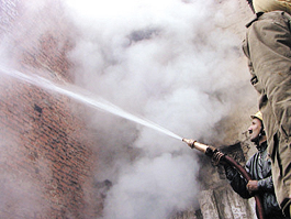 Firefighters trying to put out the blaze in a plastic factory in the Capital.
