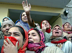 Relatives weep during the funeral of Ghulam Rasool, a worker of the PDP, after he was killed by gunmen in Srinagar on Tuesday. 