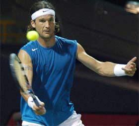Top seed and defending champion Carlos Moya in action against Julian Knowle of Austria in the ATP Tour Chennai Open in Chennai