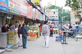 A view of encroachments in corridors and the parking area of the Sector 34 market in Chandigarh