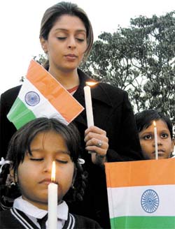 Film actress Nagma with schoolchildren paying homage to tsunami victims at Rajghat in the Capital