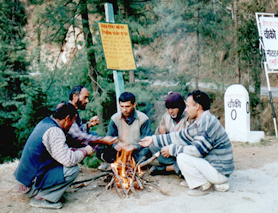 Youths of Choki village sit around fire as the sun played truant on Tuesday. Choki is situated on the Sundernagar-Karsog road at a height of 2200 metres. 