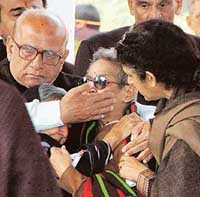 Family members console J.N. Dixits wife at the Brar Square crematorium in New Delhi on Wednesday. 