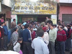 Traders stage a protest in front of an octroi post in Pathankot on Wednesday.