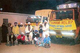 Sevadars with trucks carrying medicines and goods collected by the Vishav Gurmat Roohani Mission Charitable Trust ready to leave for Tamil Nadu from Ratwara Sahib on Thursday.