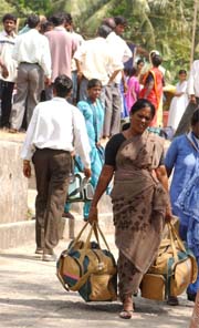 Tsunami-hit people in Port Blair gather their belongings to travel to Chennai mainland on Thursday. 