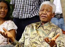 Former South African President Nelson Mandela speaks to mediapersons following the death of his only surviving son Makgatho Mandela 